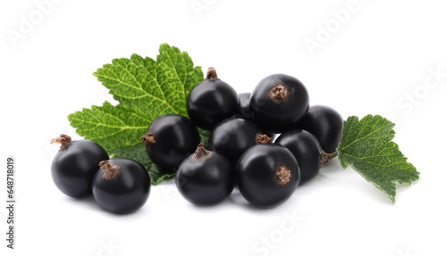 Ripe blackcurrants and leaves isolated on white