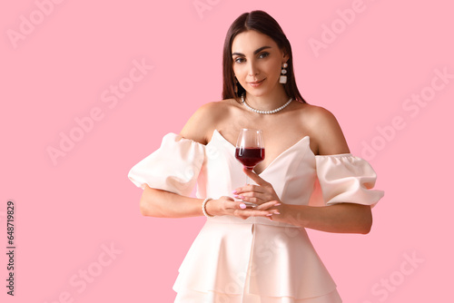 Young woman with glass of w...