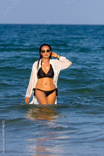 Woman body pretty with black  bikini on beach