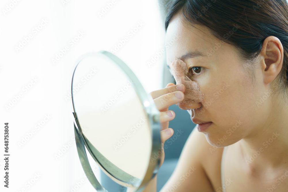 Close up of happy Asian beautiful woman portrait during her face and nose covered by soft splint after have a beauty plastic surgery Close up of happy Asian beautiful woman portrait during her face and nose covered by soft splint after have a beauty plastic surgery
