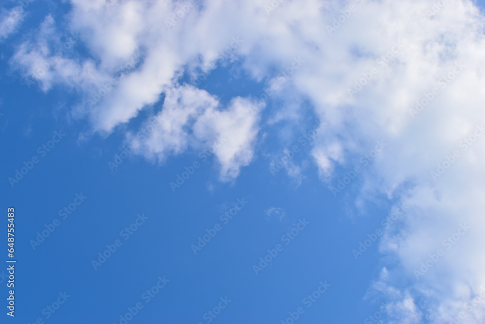 beautiful blue sky and white fluffy group of clouds with sunrise in the morning, natural background beautiful blue sky and white fluffy group of clouds with sunrise in the morning, natural background