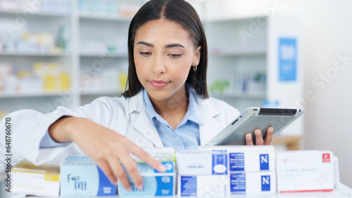 Medicine, tablet and woman chemist doing research at dispensary for prescription treatment. Medical, digital technology and female pharmacist check stock inventory for medication in drugstore clinic. photo