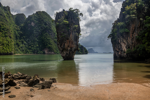 Beautiful little island. Calm sea. Green trees. Pure water. photo