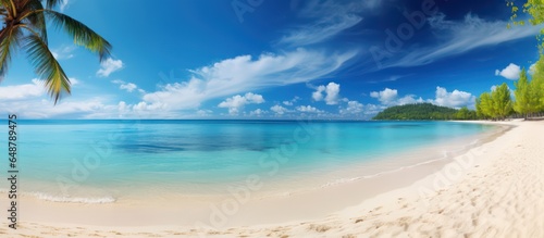 Beautiful tropical beach with white sand  turquoise ocean on background blue sky with clouds on sunny summer day