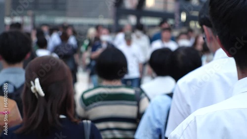 Wallpaper Mural View of crowd of people walking in Osaka, Japan. Back shot of unidentified men and women. Shot in sunset time, busy rush hour. Japanese people and urban city lifestyle concept video. Torontodigital.ca