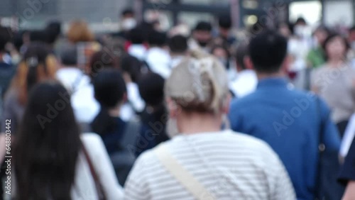 Wallpaper Mural View of crowd of people walking in Osaka, Japan. Back shot of unidentified men and women. Shot in sunset time, busy rush hour. Japanese people and urban city lifestyle concept video. Torontodigital.ca