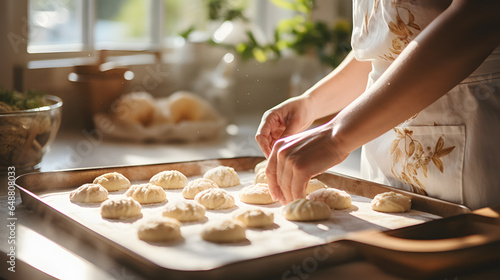 Close up of a white caucasian woman's hands making cookies photo