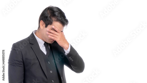 Portrait working Asian business handsome man ware suit is stressed from work on white background with copy space - business concept