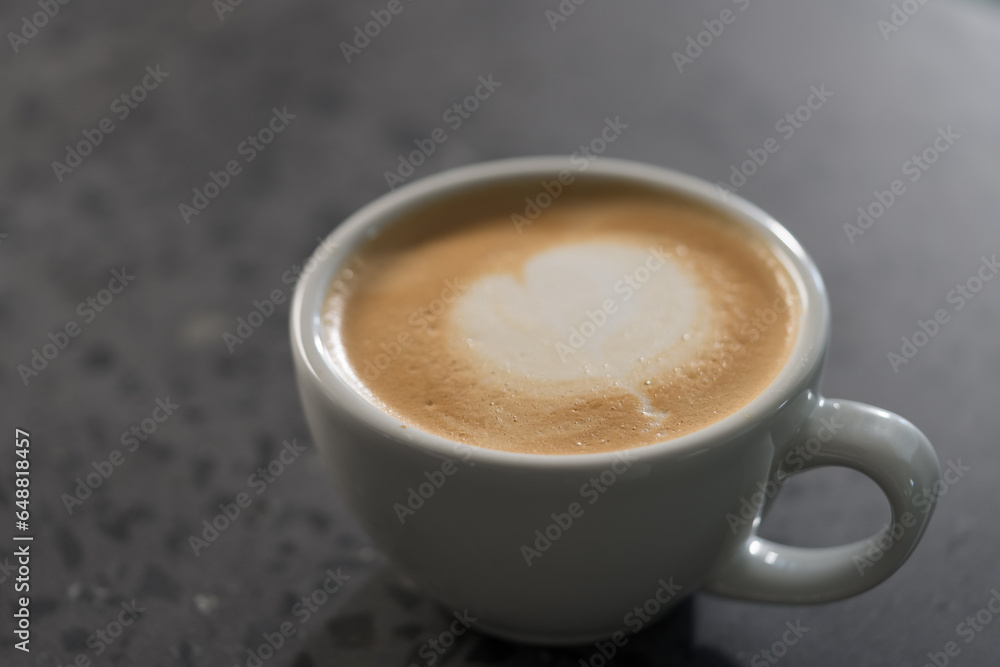 Fresh cup of cappuccino on concrete countertable Fresh cup of cappuccino on concrete countertable