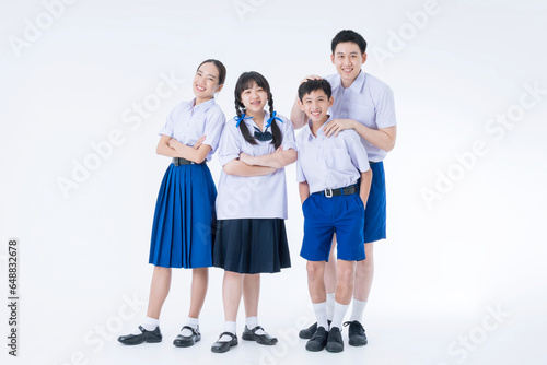 Thai students. Group students standing together in the studio. Asian girl and boy in student uniform on white background.