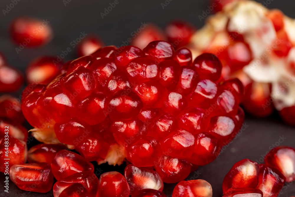 Peeled red pomegranate with ripe grains Peeled red pomegranate with ripe grains