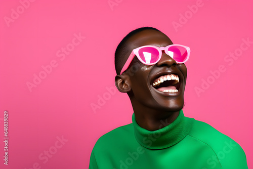 Colorful studio portrait of an ethnic man smiling happily. Pink and green. Generative AI