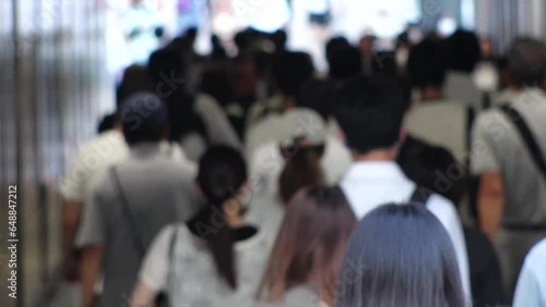 Wallpaper Mural TOKYO, JAPAN - JULY 2023 : Crowd of people walking at the street near Shinjuku station in busy rush hour. Japanese people, urban city life and lifestyle concept video. 4K time lapse shot. Torontodigital.ca