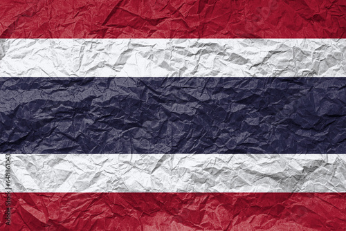 Flag of Thailand on crumpled paper. Textured background.