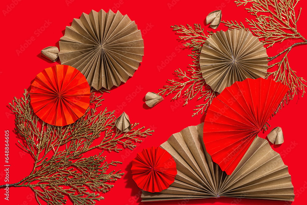 Happy Chinese New Year traditional concept. Oriental asian style paper fans on red background