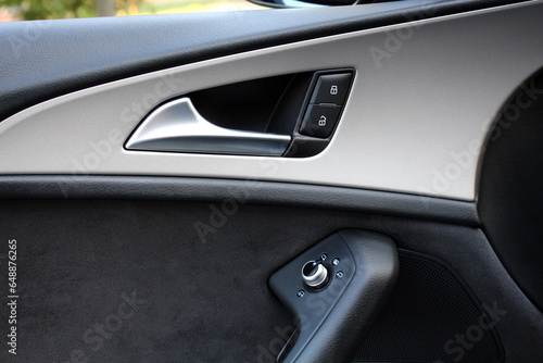 Door handle with power window control. Car interior details. Modern car interior. © Best Auto Photo