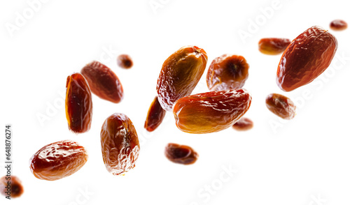 Dates fly and levitate in space. Volumetric light from behind. Selective focus. Isolated on white
