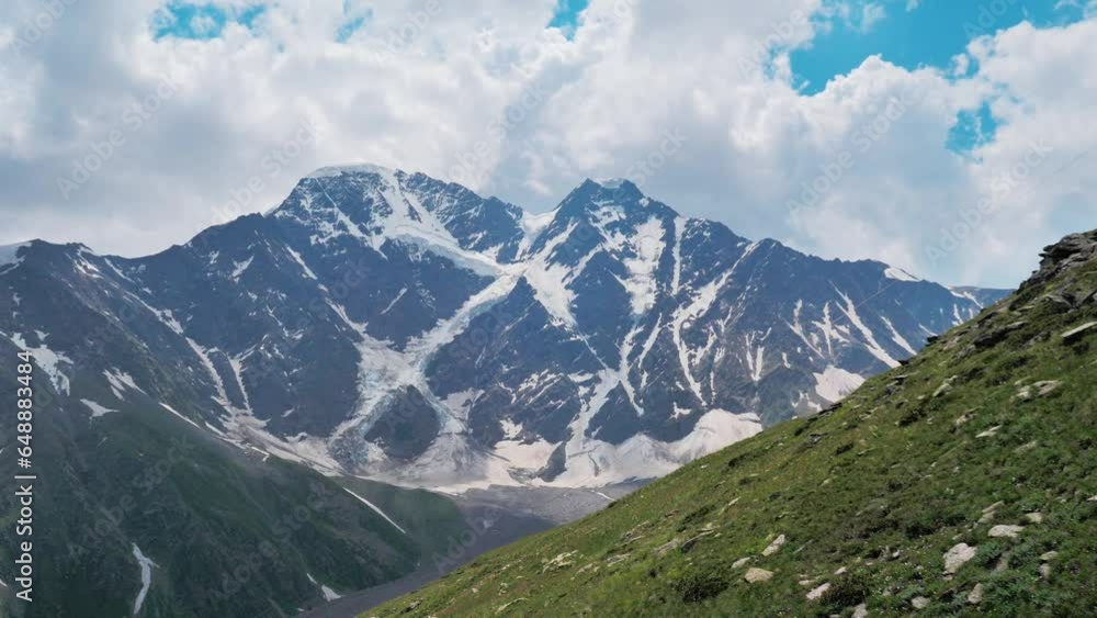 Stunning view from mount Cheget on a Semerka glacier in summer. Caucasus Mountains. Kabardino-Balkaria. Russia Stunning view from mount Cheget on a Semerka glacier in summer. Caucasus Mountains. Kabardino-Balkaria. Russia