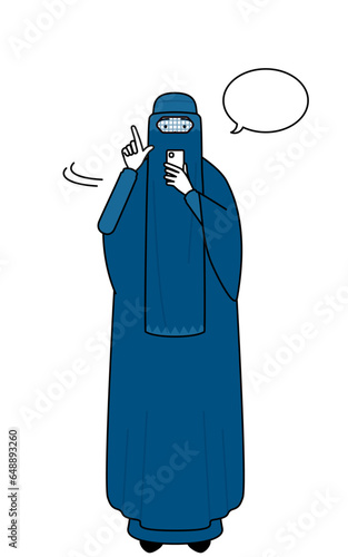 Muslim woman in burqa operating a smartphone.