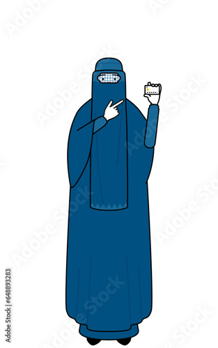Muslim woman in burqa recommending credit card payment.