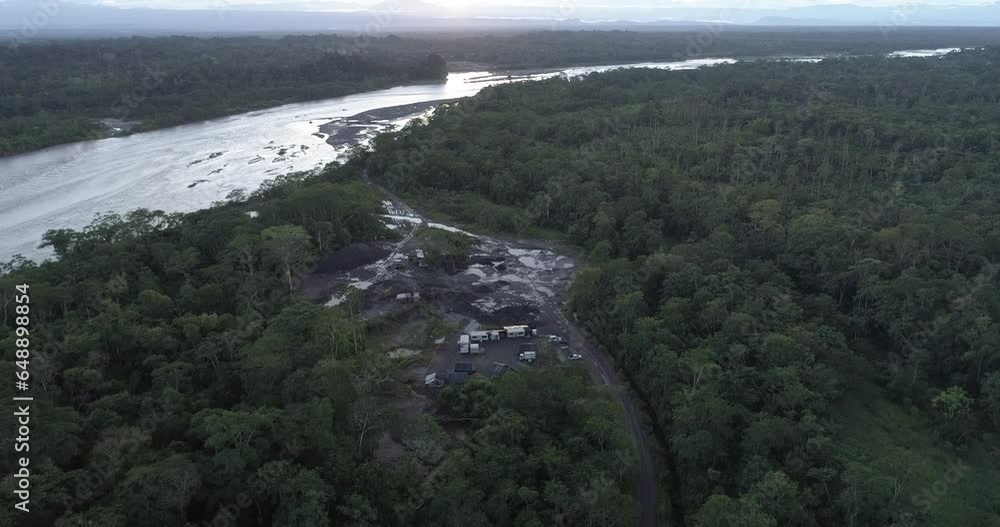drone flight over a camp of workers working in the middle of the jungle or forest, with helmets, boots, hose and machinery drone flight over a camp of workers working in the middle of the jungle or forest, with helmets, boots, hose and machinery