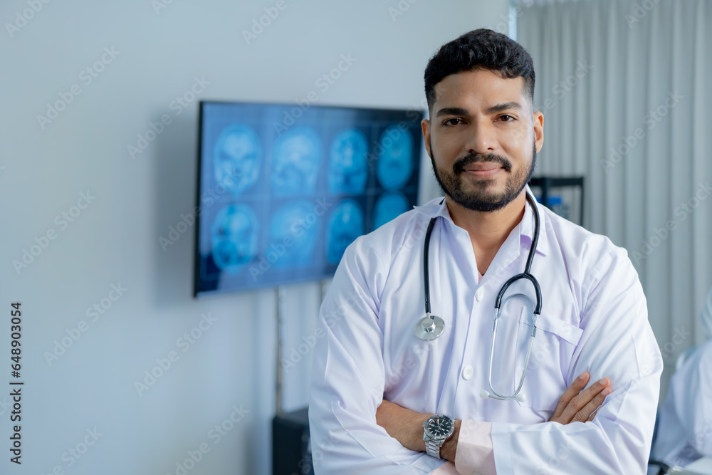 Medical Hospital Portrait: Healthcare and medical concept. Medicine muslim doctor with a stethoscope in hand and Patients come to the hospital background. Medical Hospital Portrait: Healthcare and medical concept. Medicine muslim doctor with a stethoscope in hand and Patients come to the hospital background.
