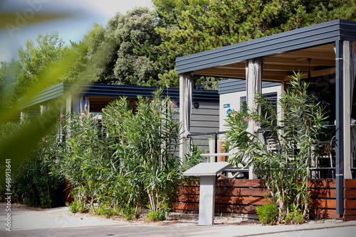 Luxury mobile homes with a terrace in a campsite on the island of Krk in Croatia, Europe. Modern camping houses for accommodation on the coast of the Adriatic sea in Croatia.