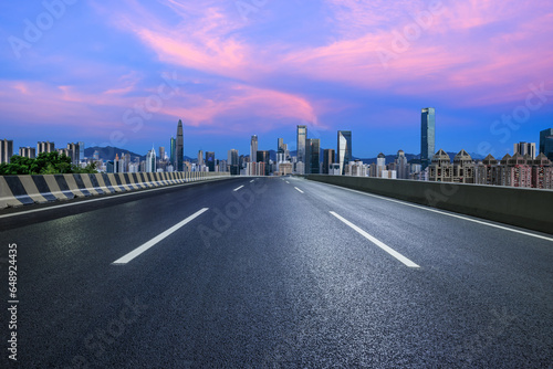  Asphalt highway road and urban skyline in Shenzhen at sunset  Guangdong Province  China.