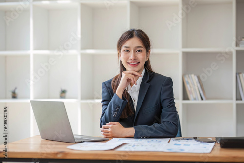 Portrait of accountant woman working on financial strategy as growth at startup company with smile.