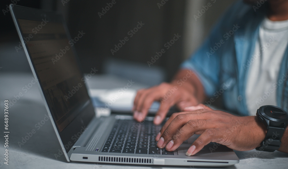 A business man is checking daily online stock market prices through a laptop at home with graphs displayed on the screen. Concept of daily business uncle A business man is checking daily online stock market prices through a laptop at home with graphs displayed on the screen. Concept of daily business uncle