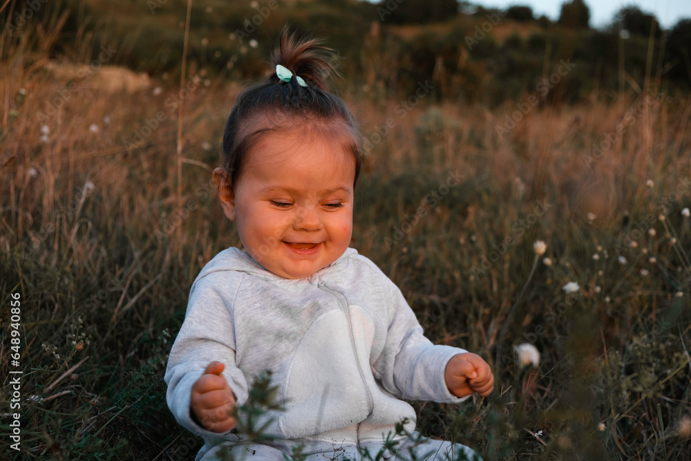 enthusiasm and joy on the child's face contemplating nature flowers and insects enthusiasm and joy on the child's face contemplating nature flowers and insects
