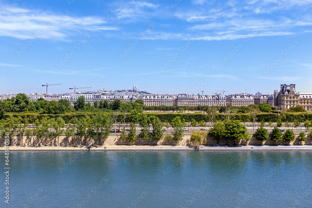 View of Montmartre Hill and Sacre Coeur Church, Seine River embankment, Paris, France