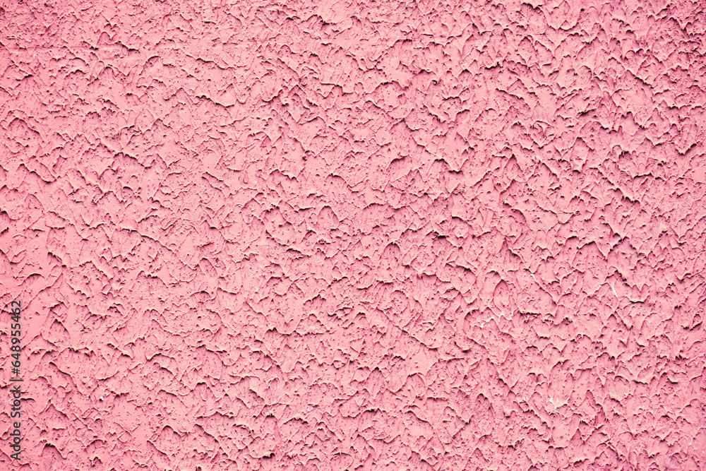 Fototapeta premium The texture of a red rough stone wall. Large stone wall background