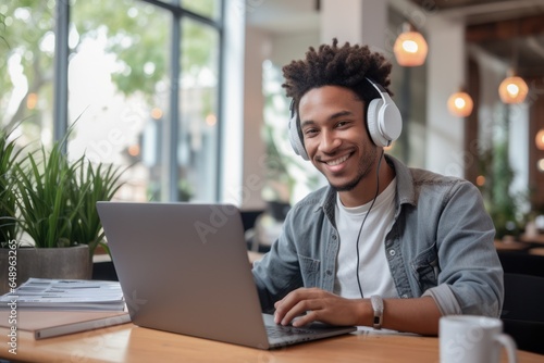 African American student with laptop, engaged in virtual learning through an online platform, showcasing remote education.
