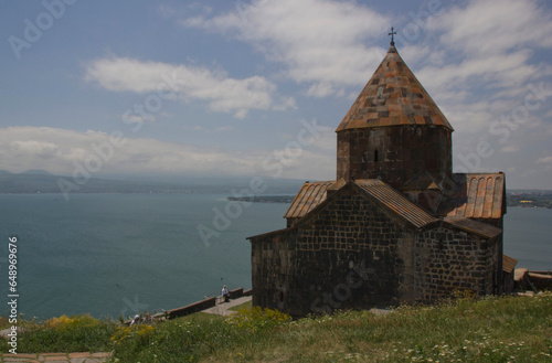 Beautiful view of the Sevan mountain lake. The ancient Church of Armenia.