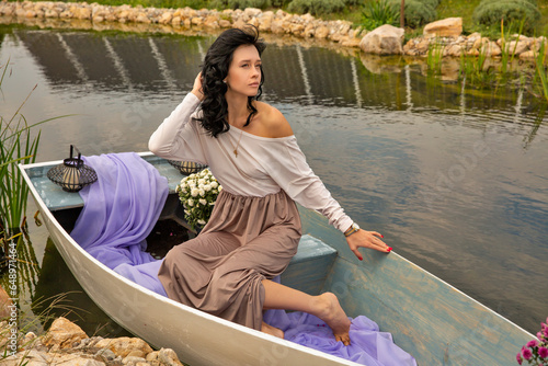 Beautiful young caucasian woman sitting on a boat. © Panama