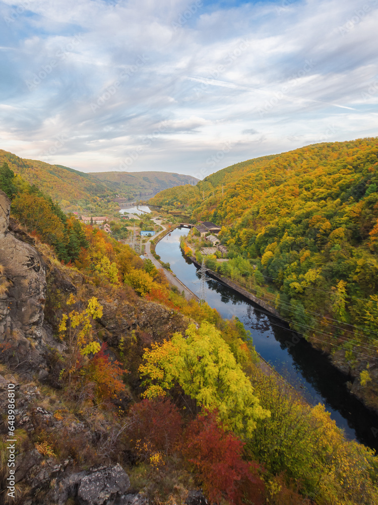 river flows through countryside valley. mountainous landscape in autumn