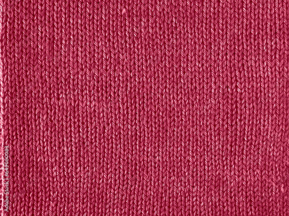 Fototapeta premium Viva Magenta color knitted Jersey as textile background. Knitted Red Magenta texture. Color of the year 2023 concept.