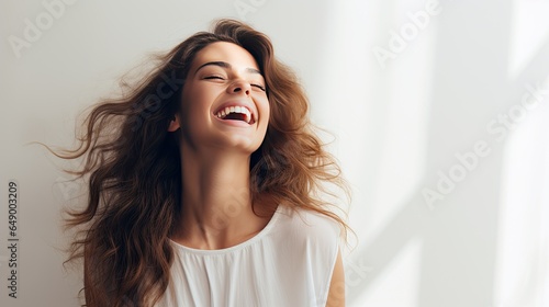 Image of a happy woman standing on a white background.