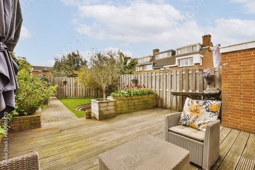 Backyard with furniture and small garden