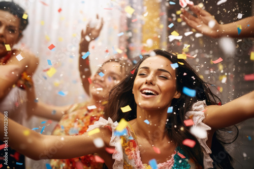 Group of women standing next to each other under shower of confetti. Perfect for celebrating special occasions or events.