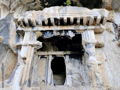 Pinara ruins of an ancient city near Fethiye, Mugla, Türkiye. Lycian tombs, ancient Roman amphitheater and mountains.