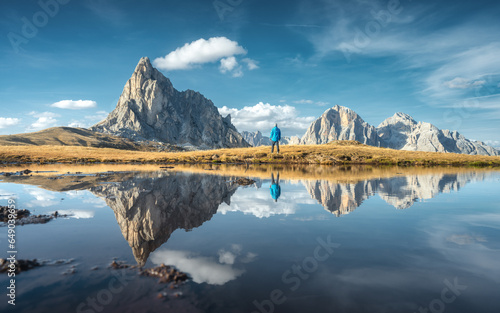 Man and mountains reflected...