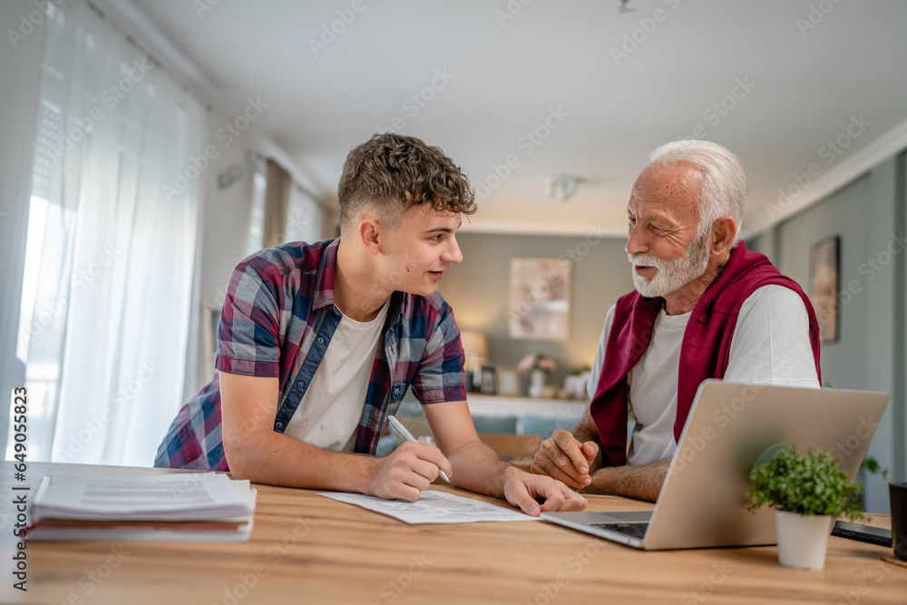 student caucasian male teenager and his grandfather or professor study student caucasian male teenager and his grandfather or professor study