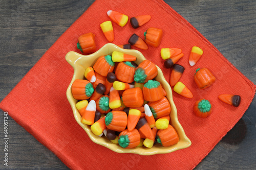 Candy corn and candy pumpkins top view.
