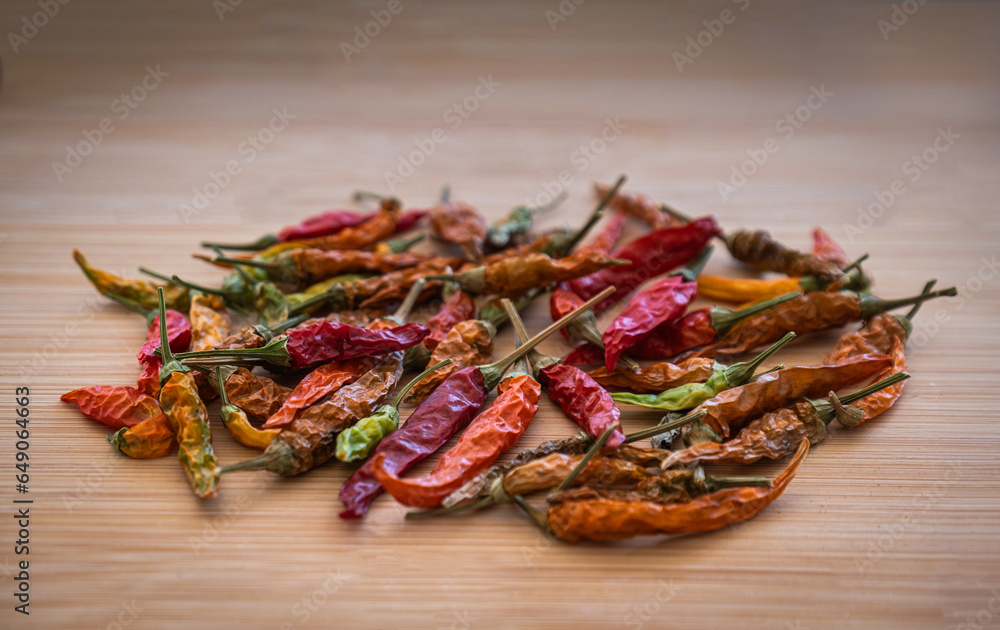 Dried small and hot peppers. on wooden background. sus biberleri.
