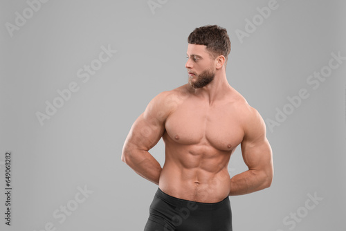 Handsome muscular man on light grey background, space for text. Sexy body