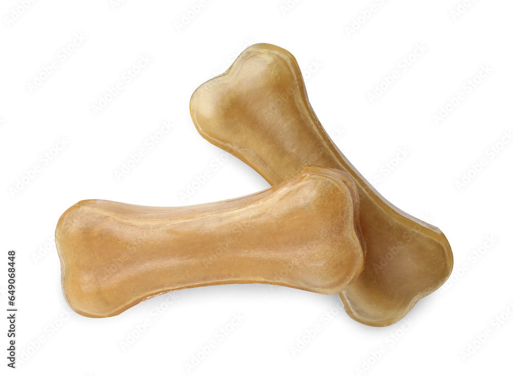 Chew bones for dog isolated on white, top view. Pet toys Chew bones for dog isolated on white, top view. Pet toys