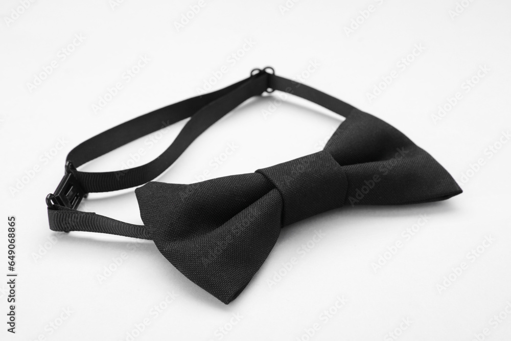 Stylish black bow tie on white background, closeup Stylish black bow tie on white background, closeup