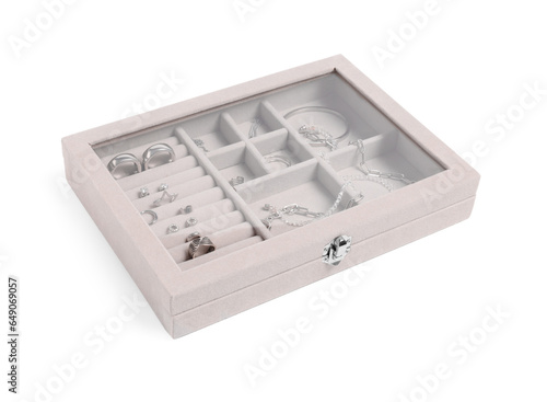 Jewelry box with many different silver accessories isolated on white